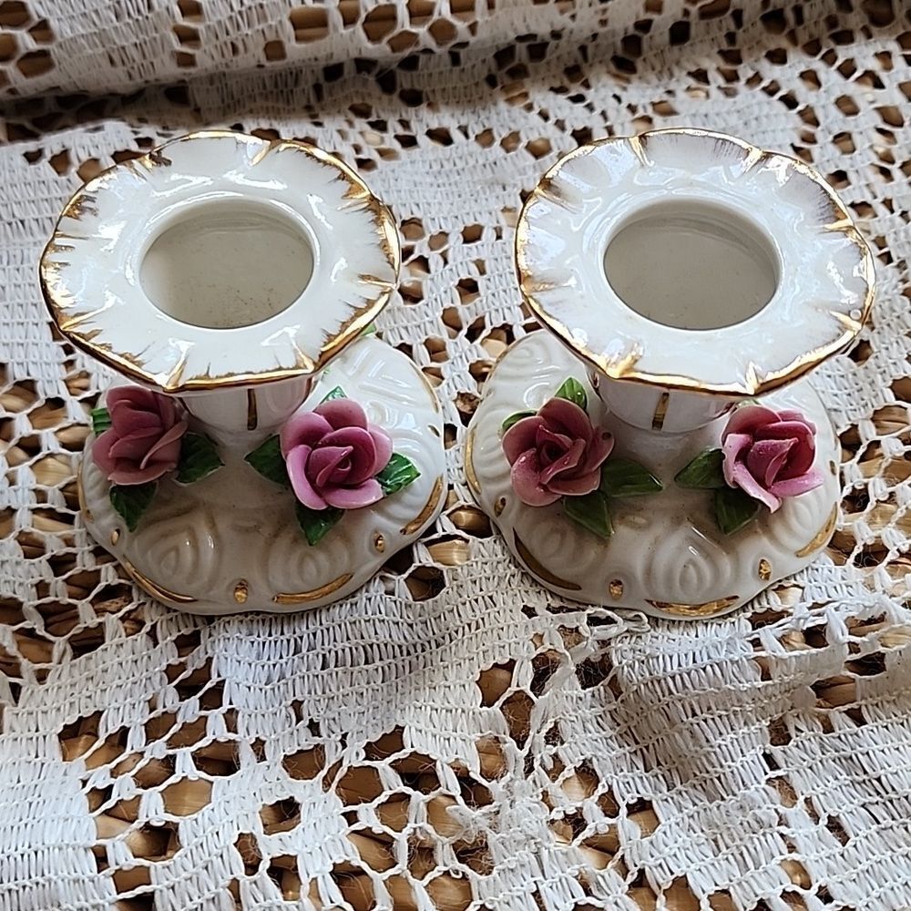 Elegant White and Gold Candle Holders with Pink Accents
